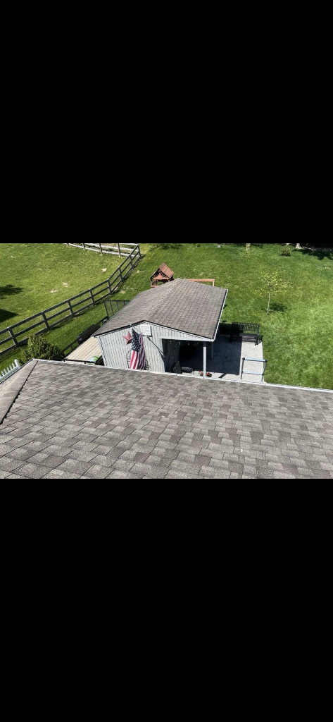 Aerial View — Completed Roof & Outbuilding