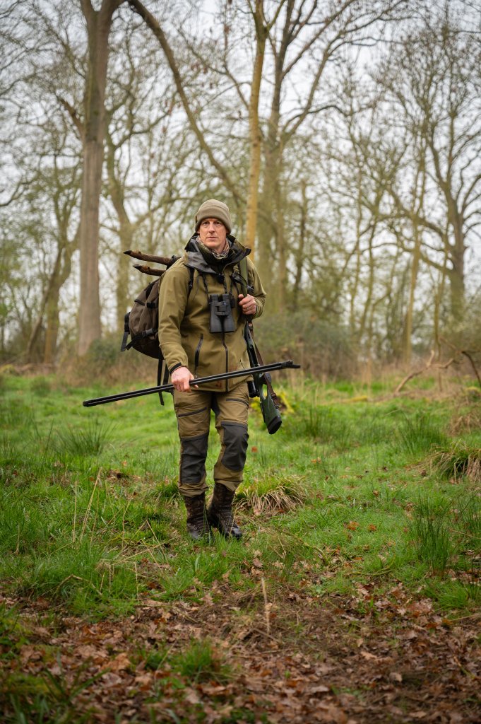 Paul Childerley deer stalking — walking the ground with rifle and binoculars in British woodland
