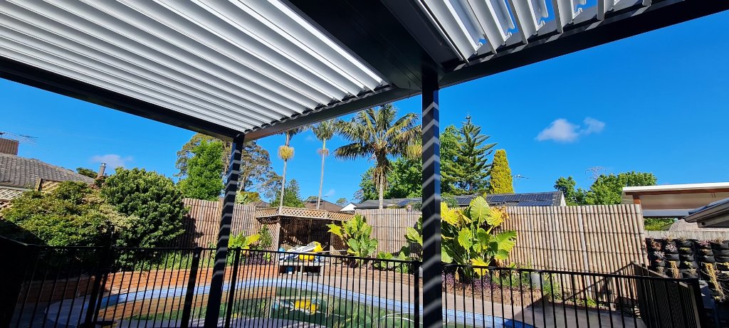 Black Pergola with Adjustable White Louvres — Poolside