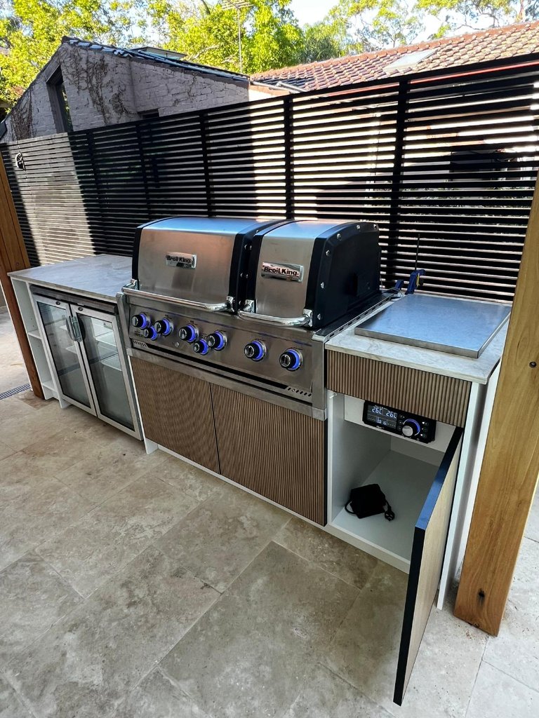 Custom outdoor kitchen with Broil King grill and beverage fridge
