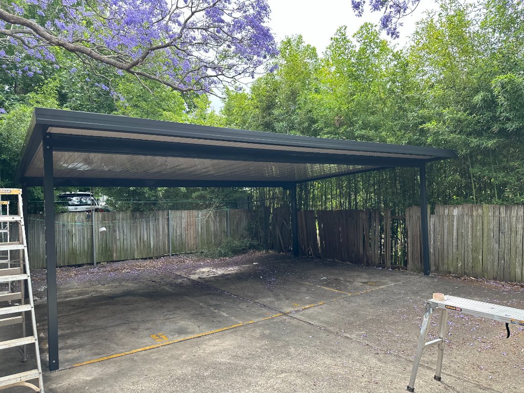 Completed carport replacement with cream ribbed ceiling panels