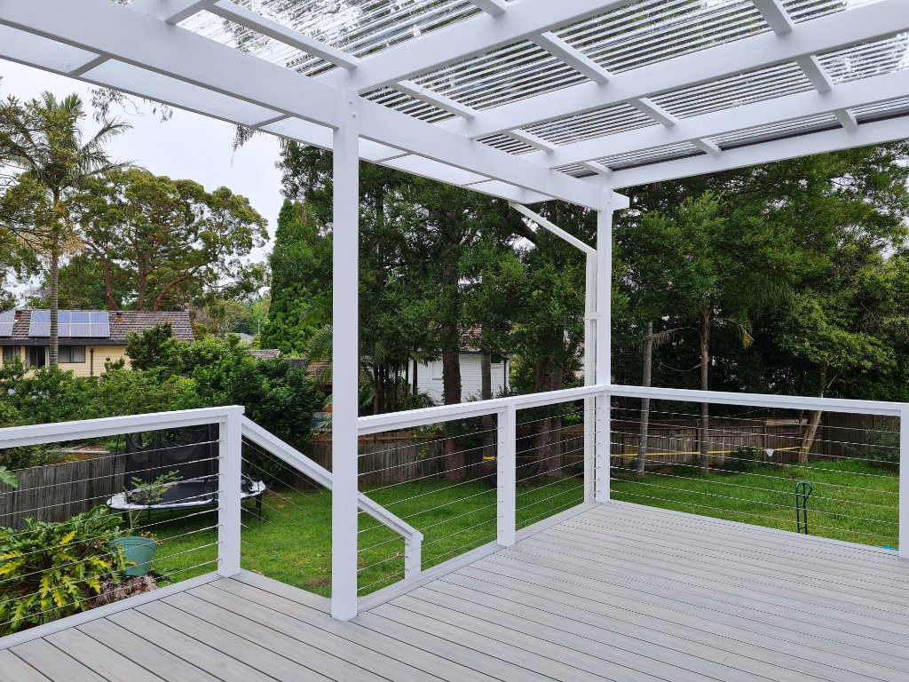 White Pergola with Polycarbonate Roof & Wire Balustrade