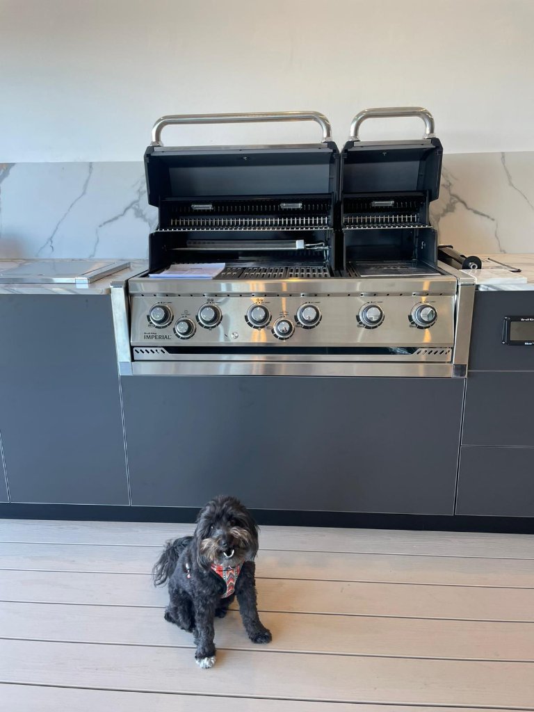 Imperial grill built into outdoor kitchen with marble countertop