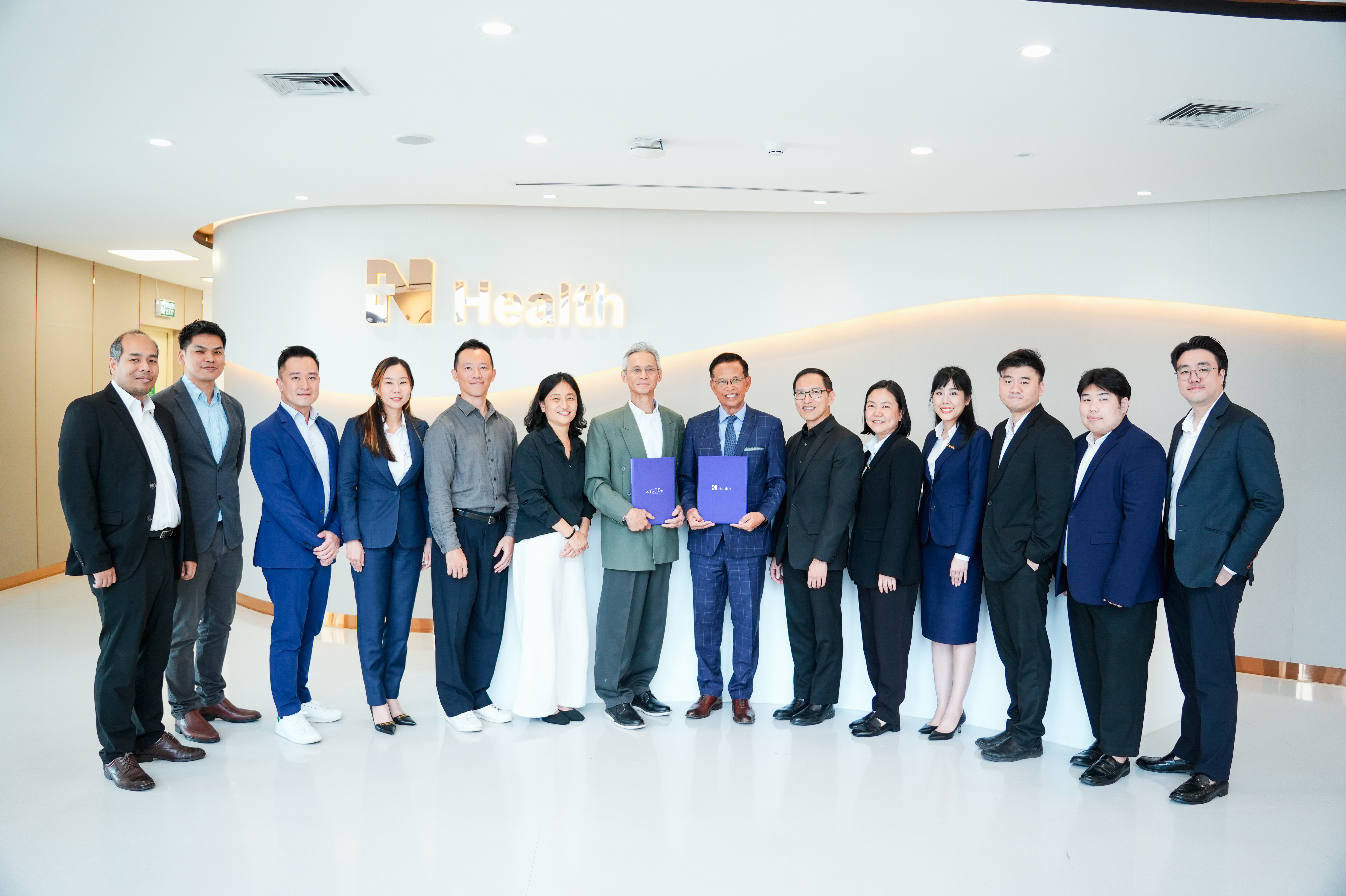 AITbiotech and N Health teams at the partnership signing