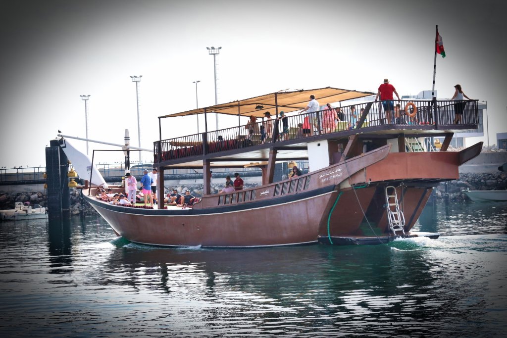 Full boat of guests at dock event gathering with blue waters and clear sky