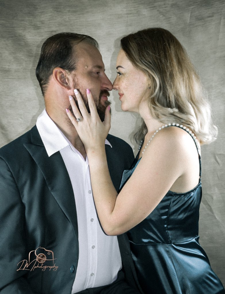Intimate couple close-up with noses touching studio portrait