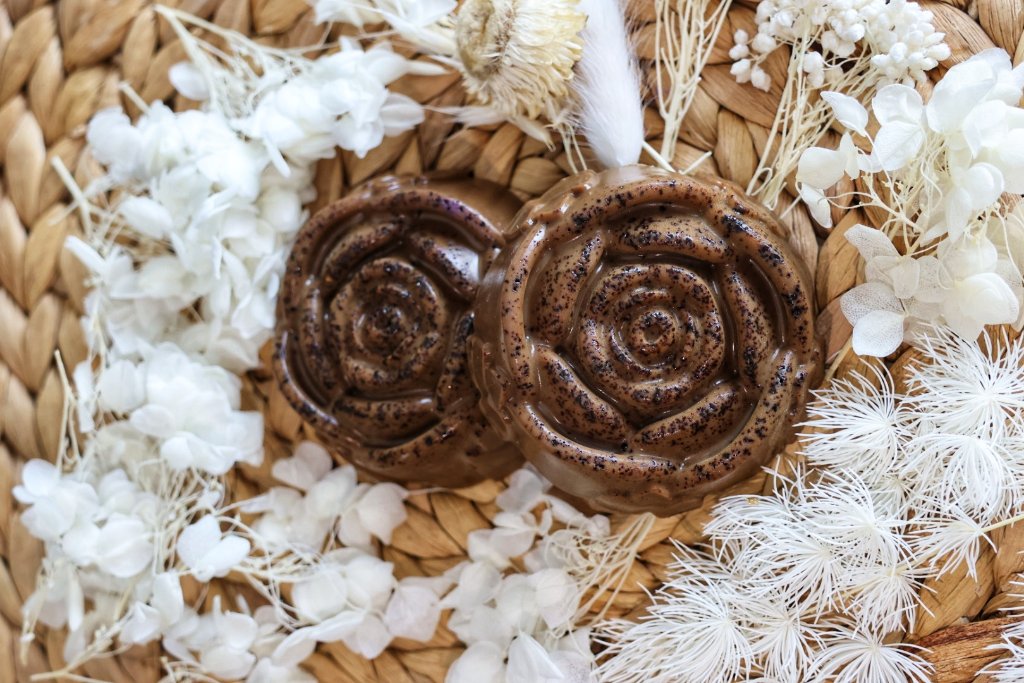Coffee scrub rose-shaped soap bars with white dried flowers product photography