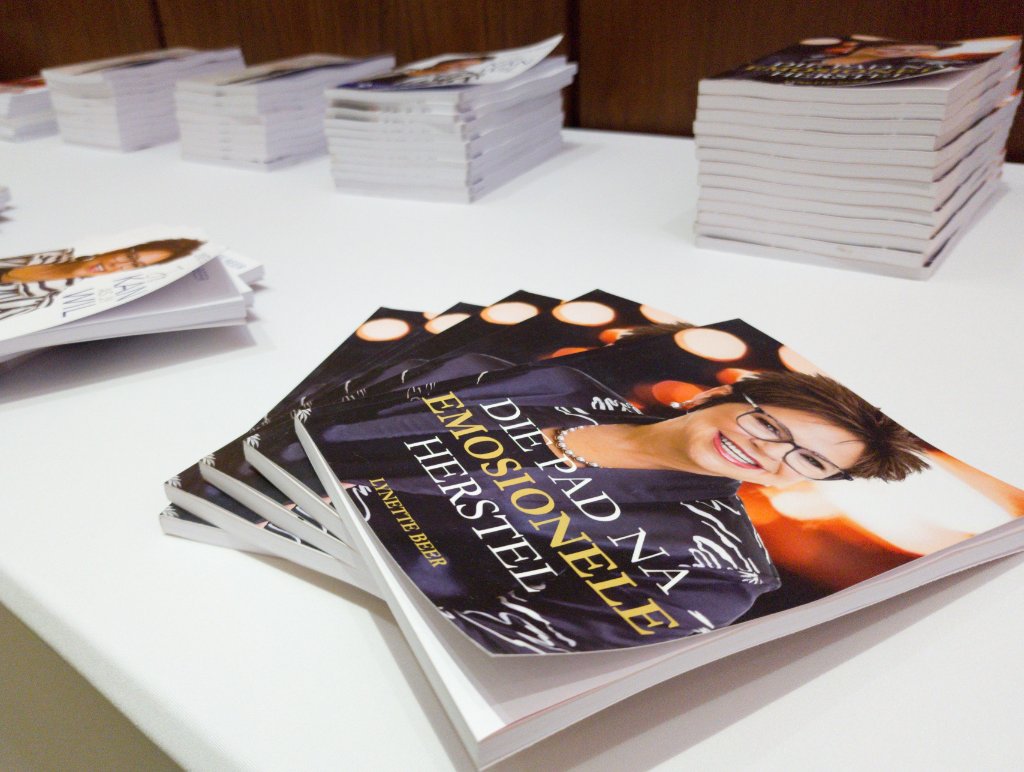 Books stacked on table at event