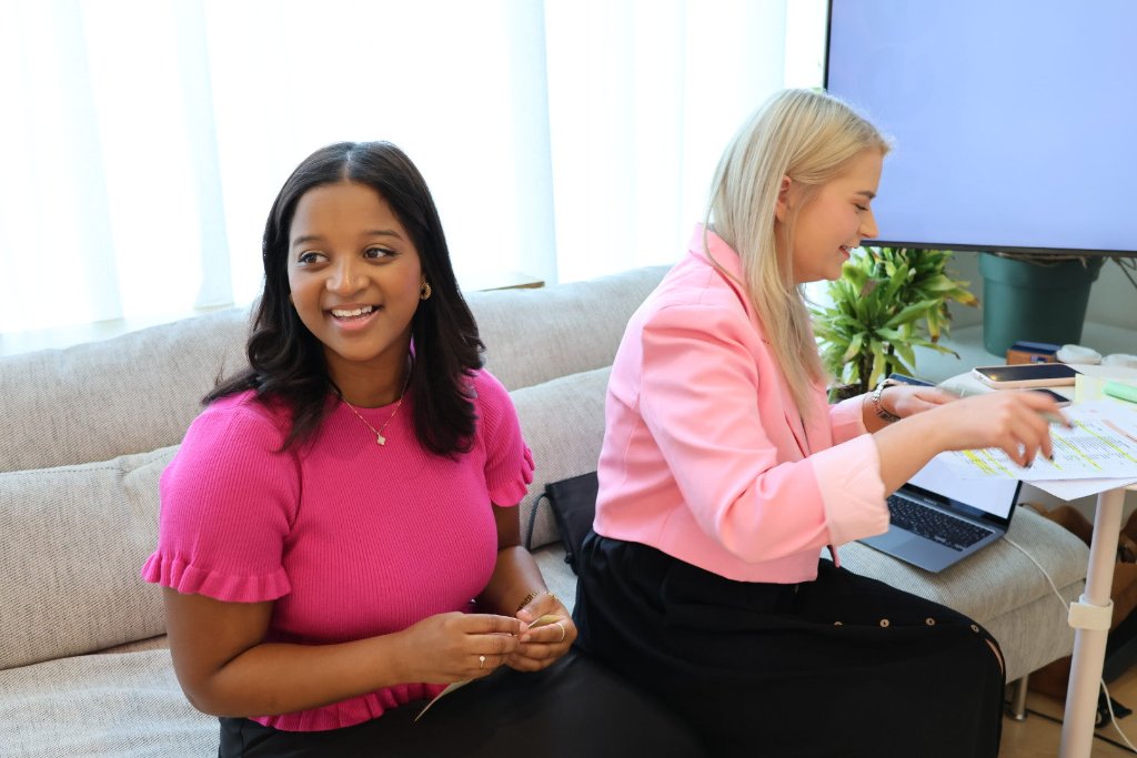 Two women working together at event preparation