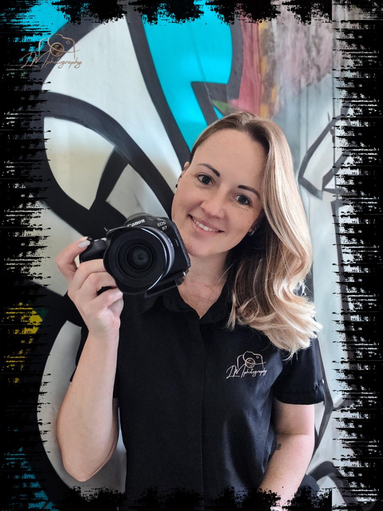 Lynn-Marie Loots - DW Photography founder holding her Canon EOS R7