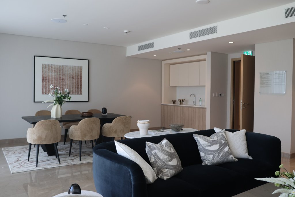 Upscale apartment interior with designer living room, dining area, and contemporary furnishings