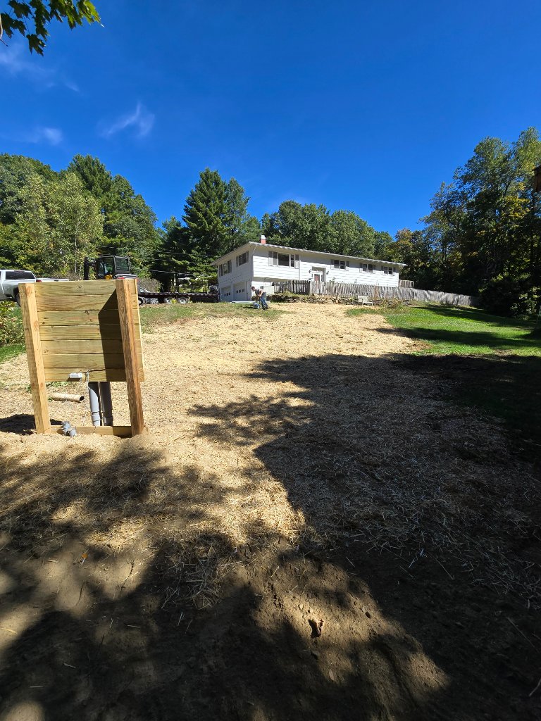 Site after trenching — restored yard with new service connection routed to the home