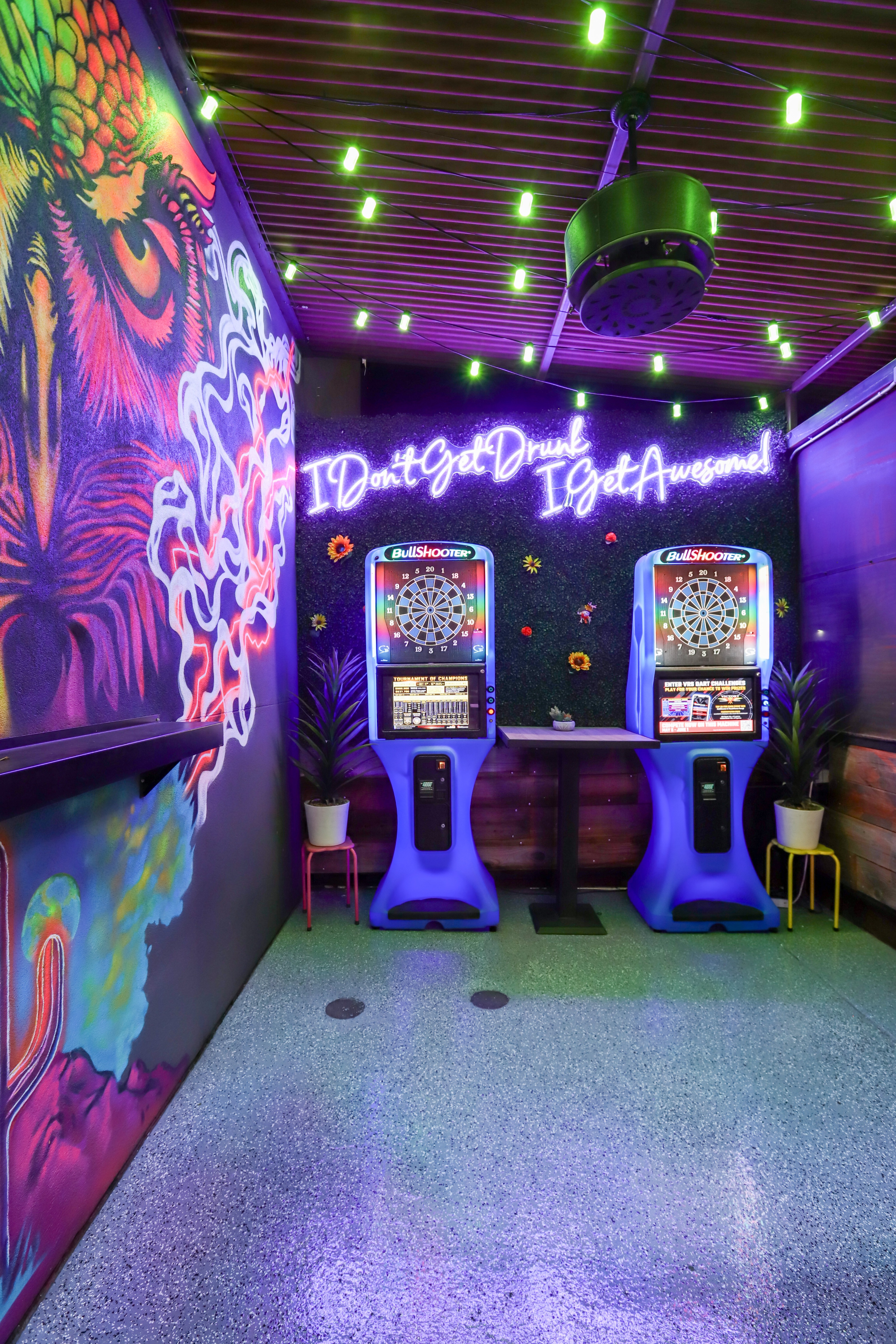 The neon owl game room with dart boards
