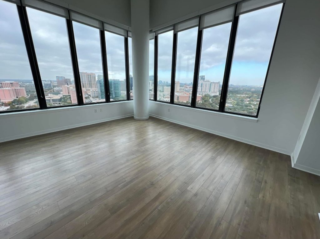Floor-to-ceiling windows with city skyline view