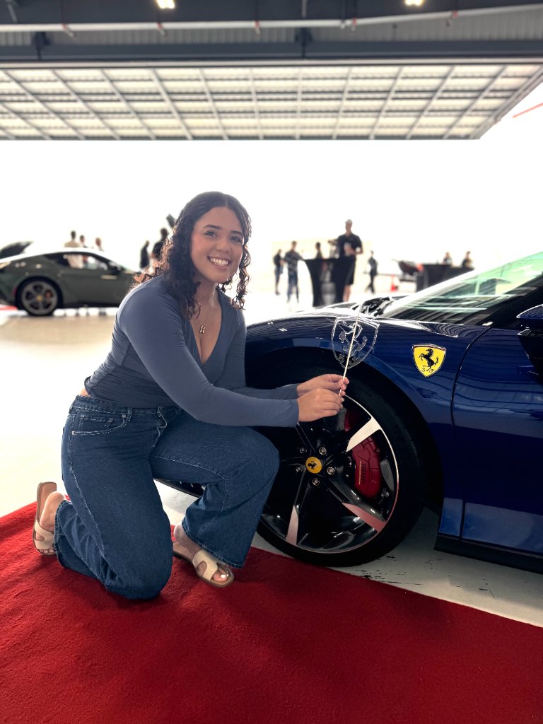 Guest posing with custom Ferrari lollipop