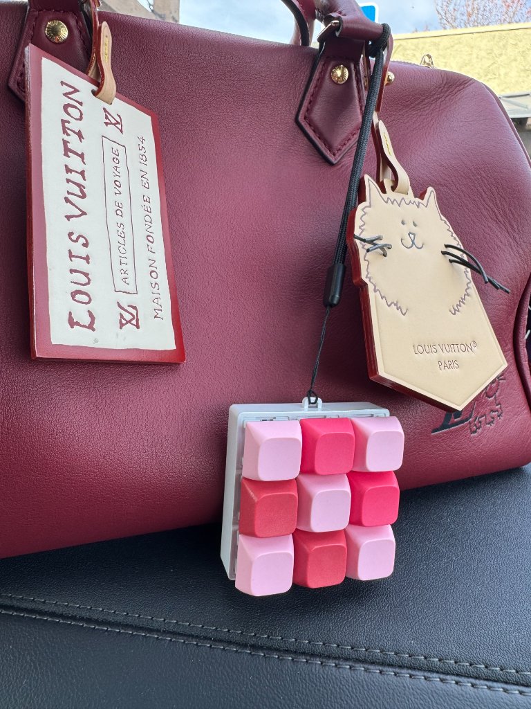 Clicky keychain hanging off purse