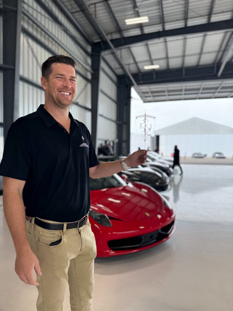Ferrari sales manager with custom sugar lollipop