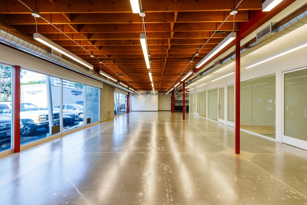 Suite 2046 with full-length glass storefront and red columns