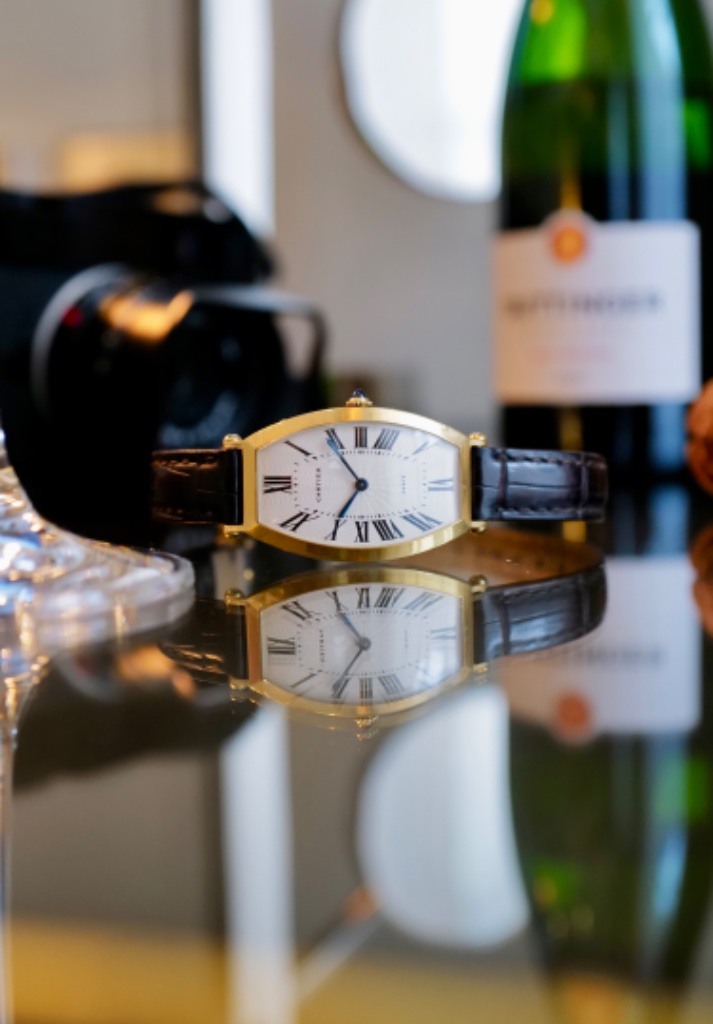 Cartier Tonneau on table