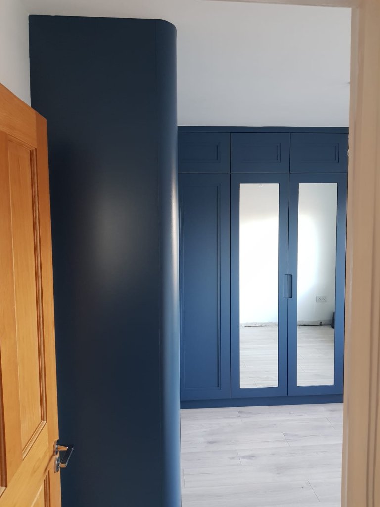 Navy blue shaker fitted wardrobes with mirror doors by HEFF