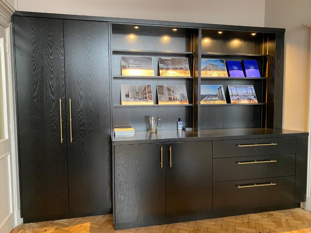 Bespoke dark oak fitted display wall unit by HEFF