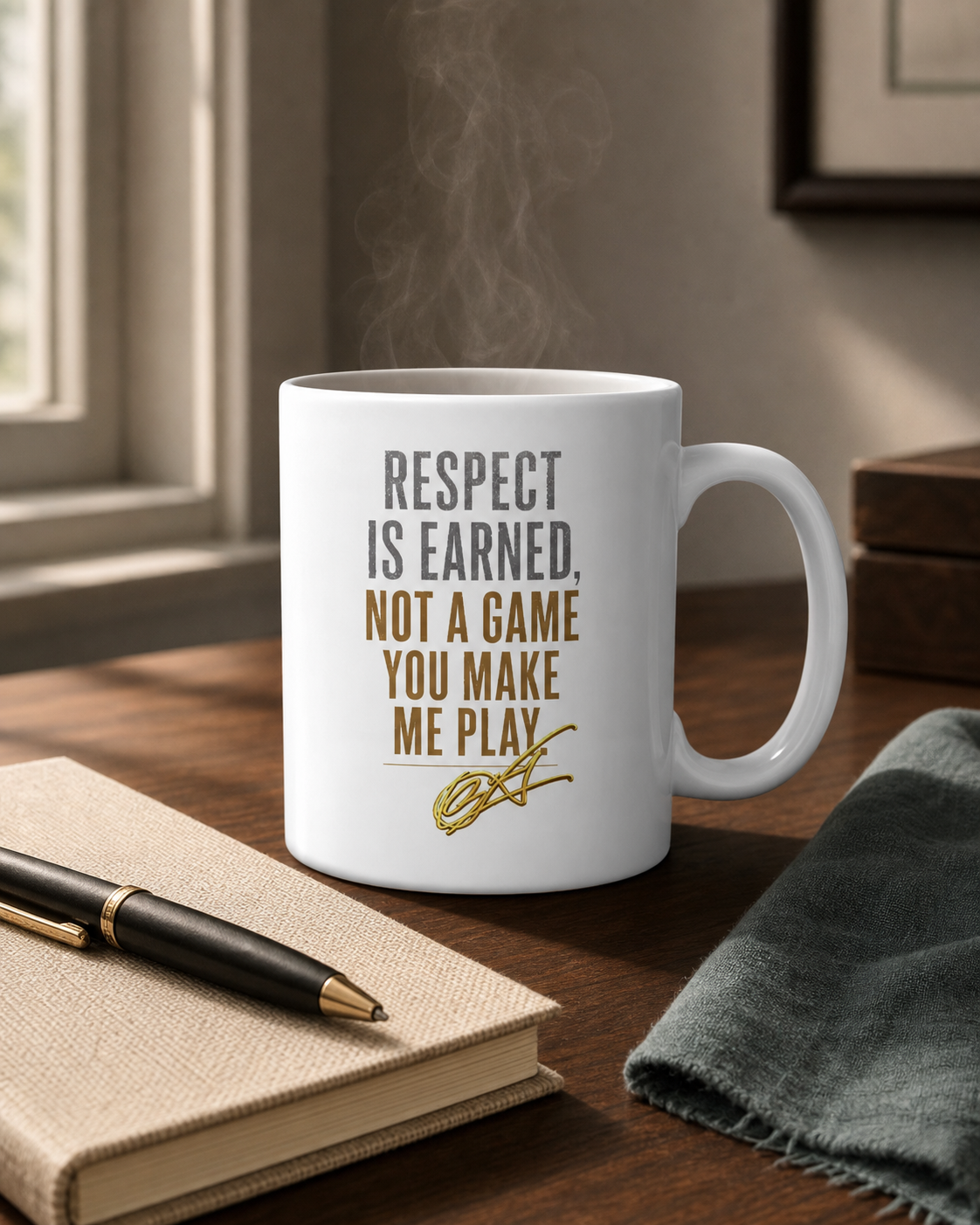 Gannon Waye mug beside an open cream notebook and pen on a dark timber table, with warm steam rising. The mug carries the Respect Is Earned campaign artwork.