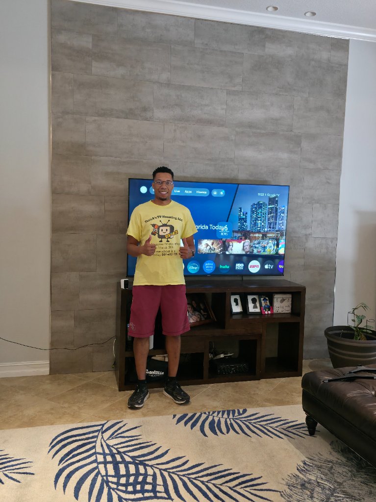 TV mounted on stone accent wall