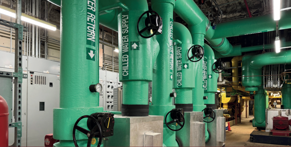 Industrial chilled water piping in a mechanical room
