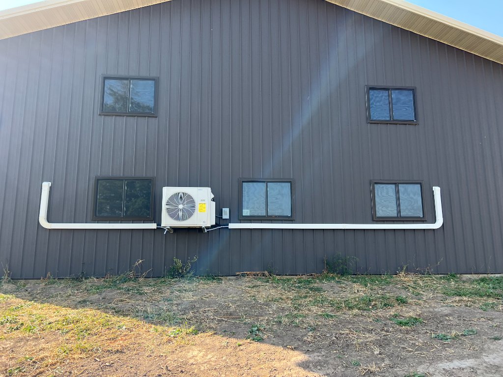 Mini-split condenser — red barn/pole building install