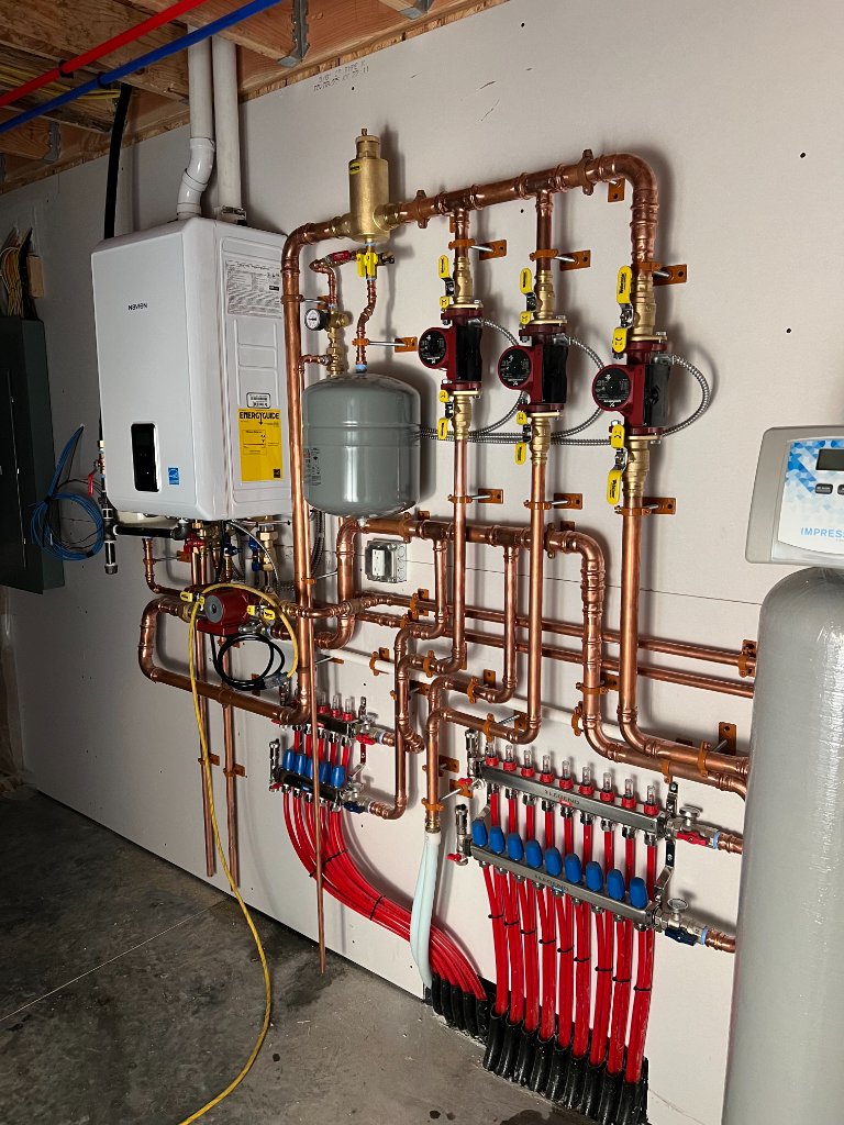 This image shows a detailed configuration of piping and components commonly associated with a boiler system.