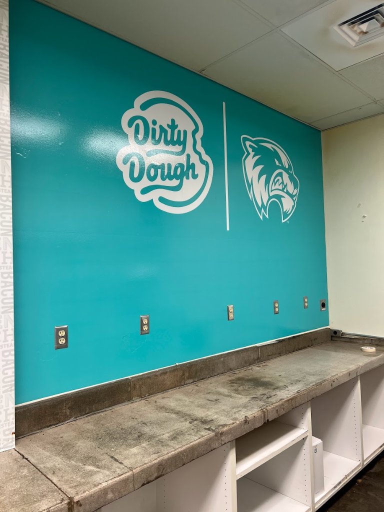 Dirty Dough Cookies branded wall mural with logo