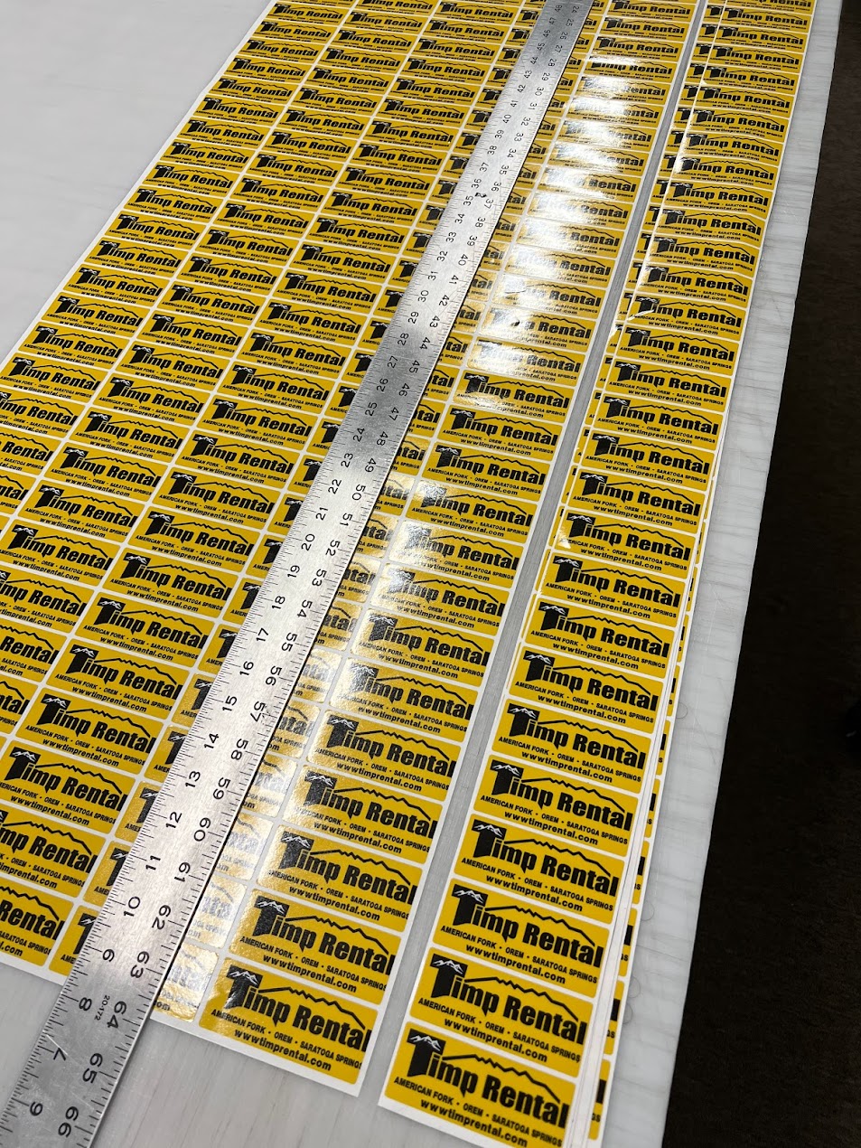 Custom Timp Rental branded stickers on roll