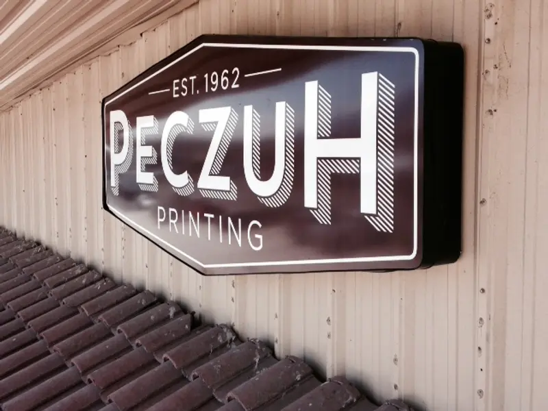Peczuh Printing illuminated sign