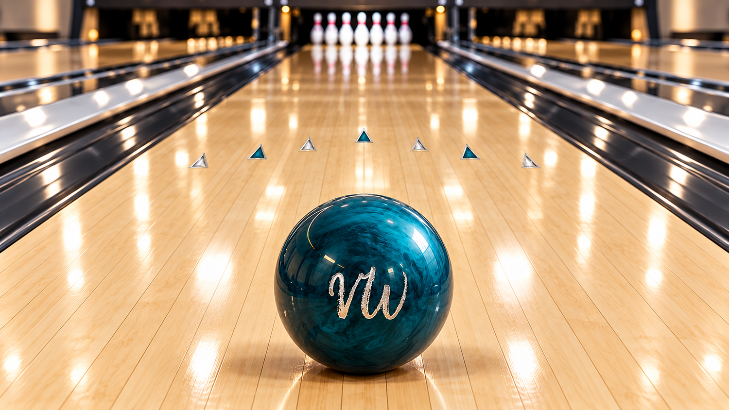 Branded VW bowling ball in teal and dark blue resting on a polished maple lane, with pins and floating triangular markers receding toward the distance