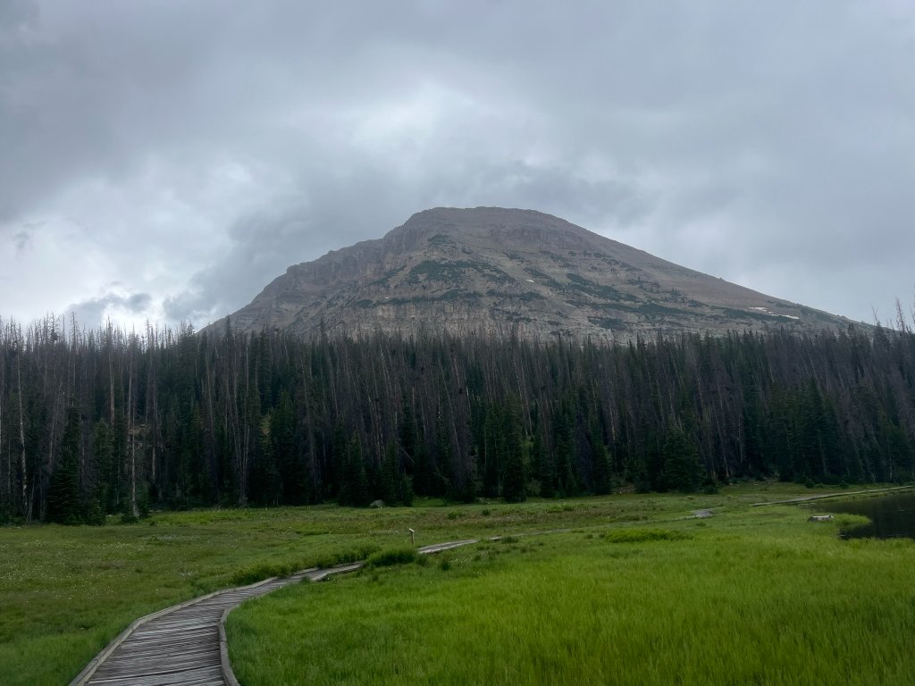 Val Wise looking across alpine lake toward mountains
