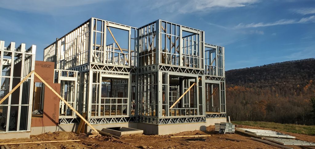 M4 jobsite — steel panels staged for erection