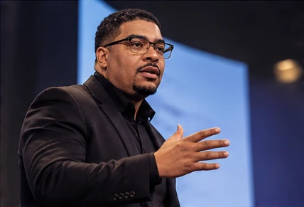 Dr. Ronell Pugh delivering a keynote on stage
