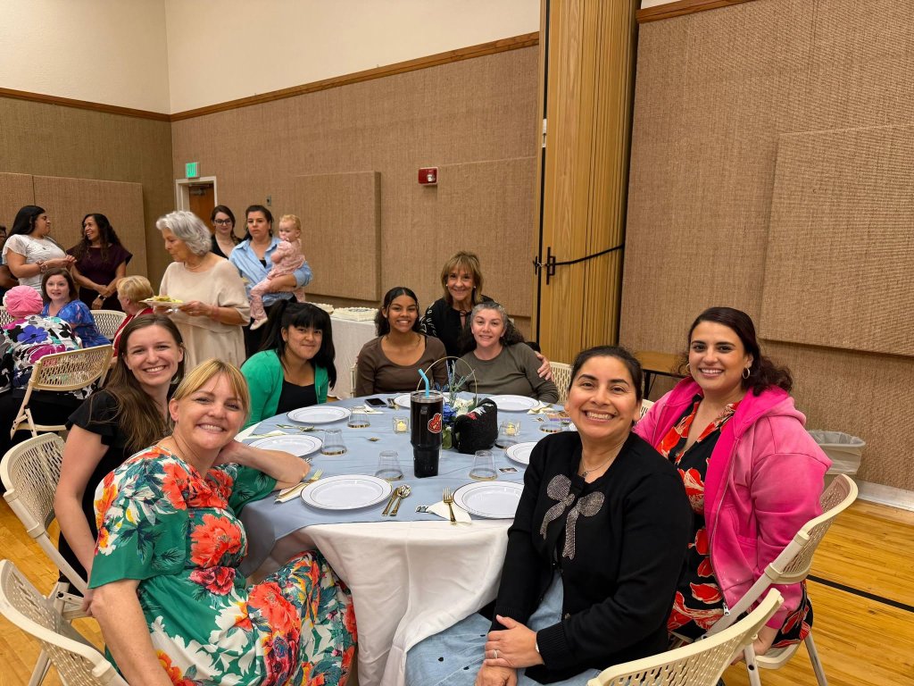 Relief Society sisters visiting at a gathering