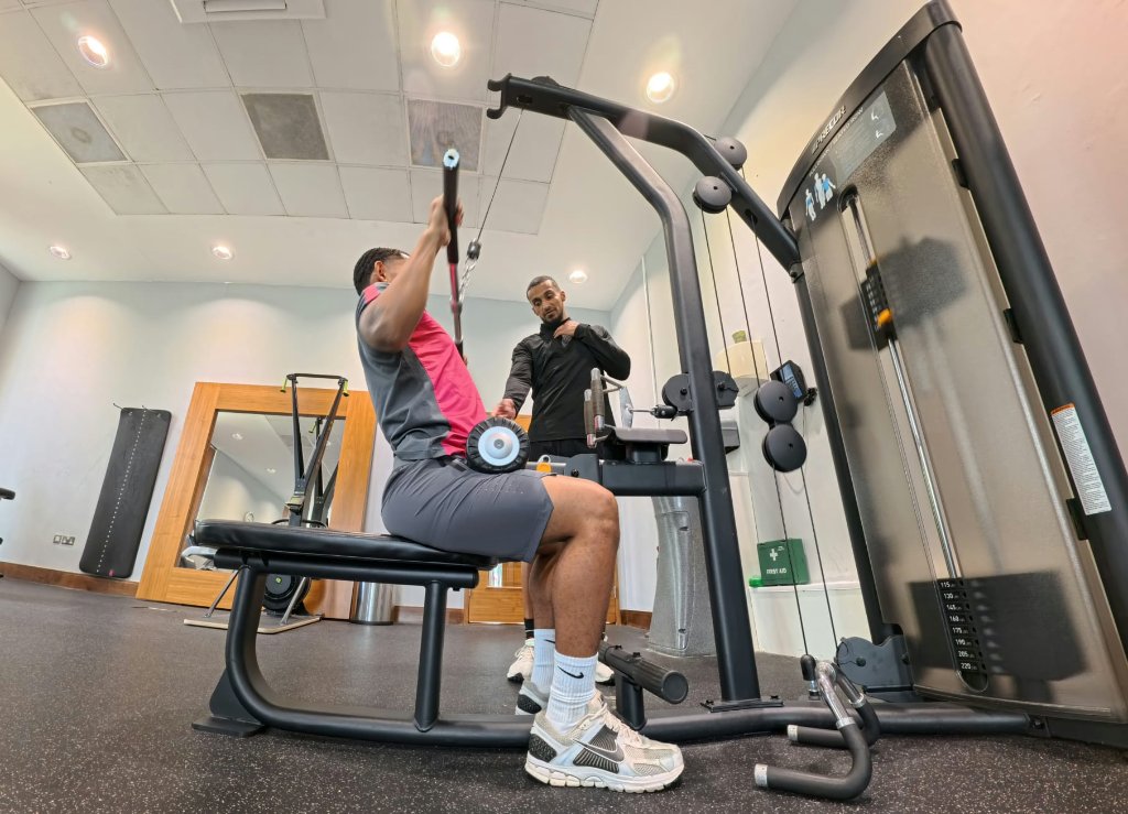 Personal trainer coaching a client at LivingWell Gym in Reading