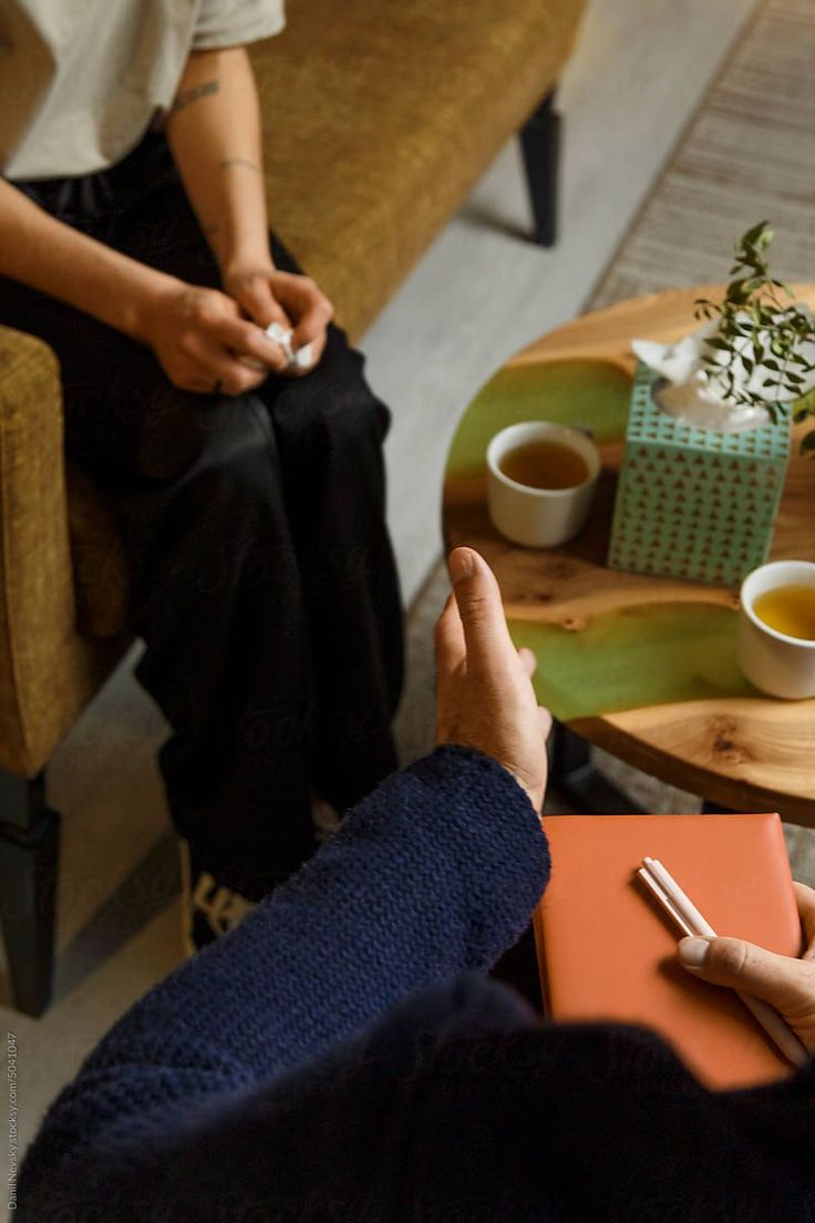 Warm therapy setting with two people having a calm conversation