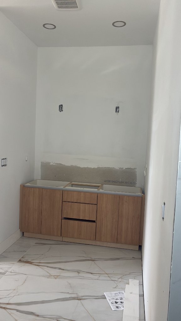 Vanity area — exposed drywall