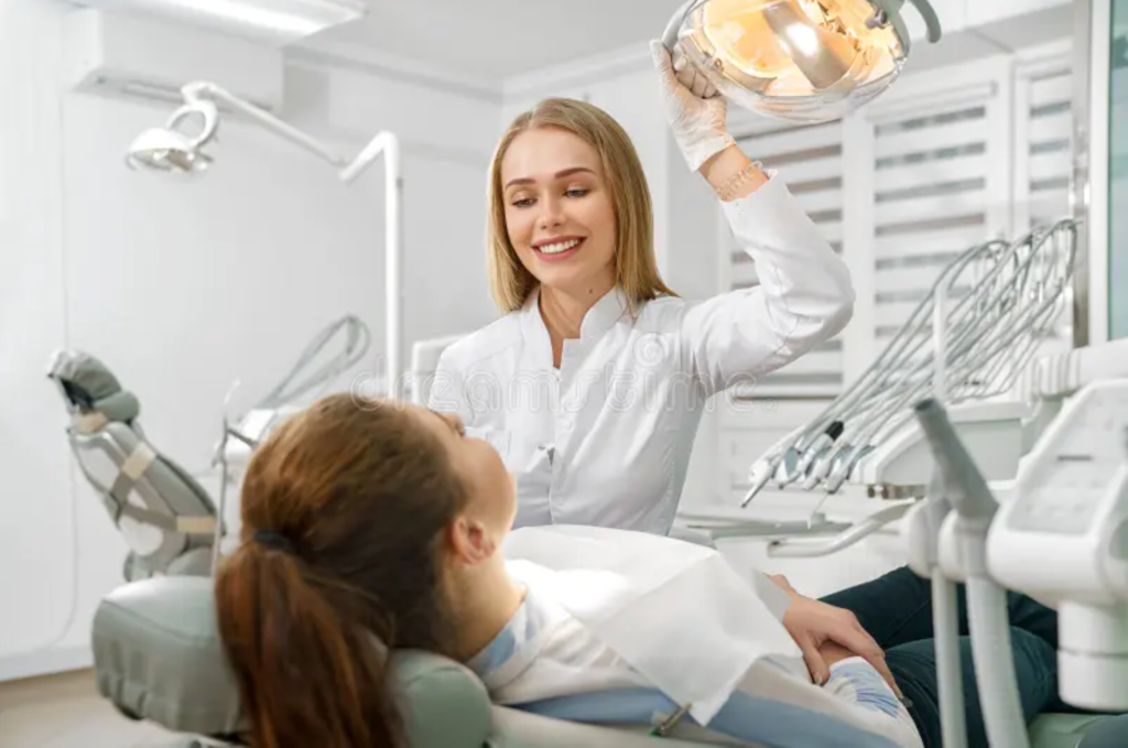 Dentist with patient in chair