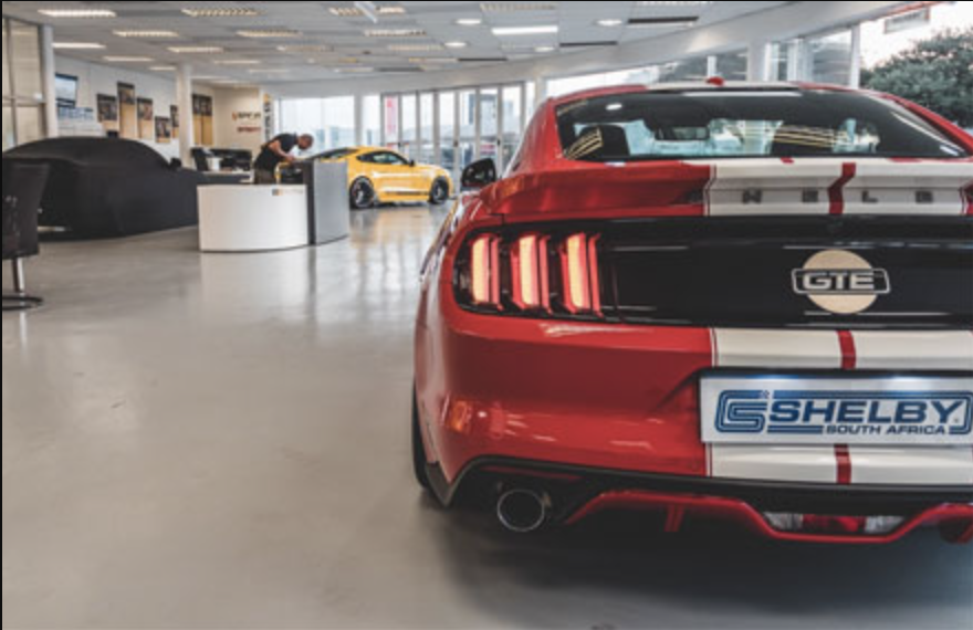 Red Shelby Mustang GTE in dealership showroom