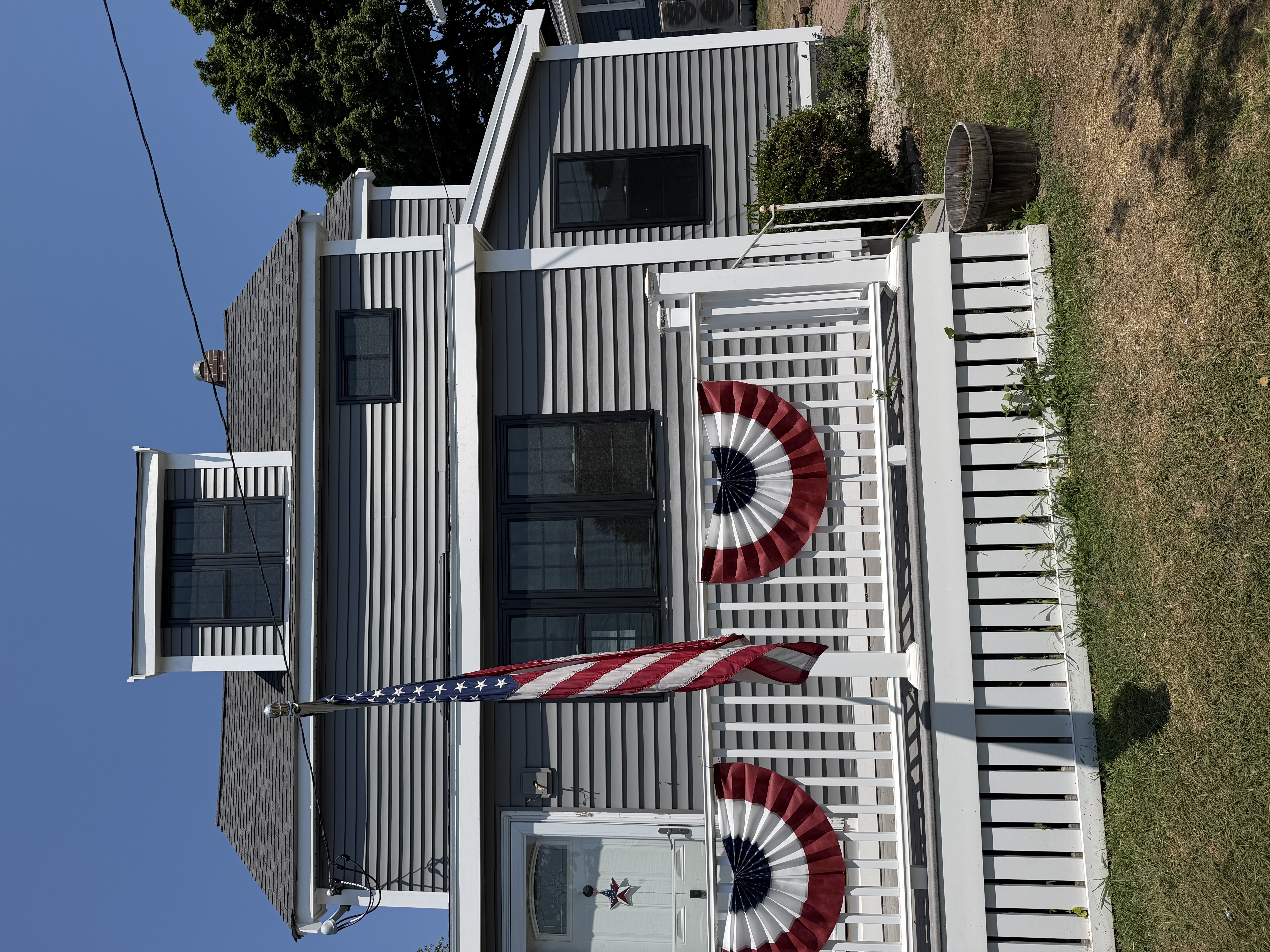 Siding & Black-Framed Windows