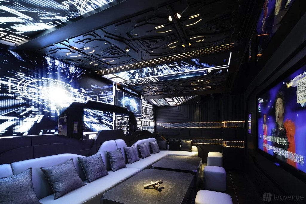 U9 London private suite with digital wall panels and L-shaped seating
