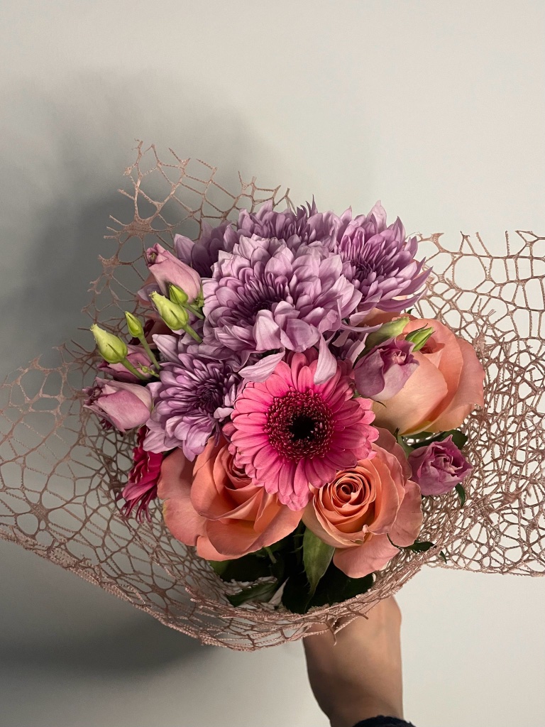 Seasonal bouquet with calla lilies and sunflower by Kalea Arrangements