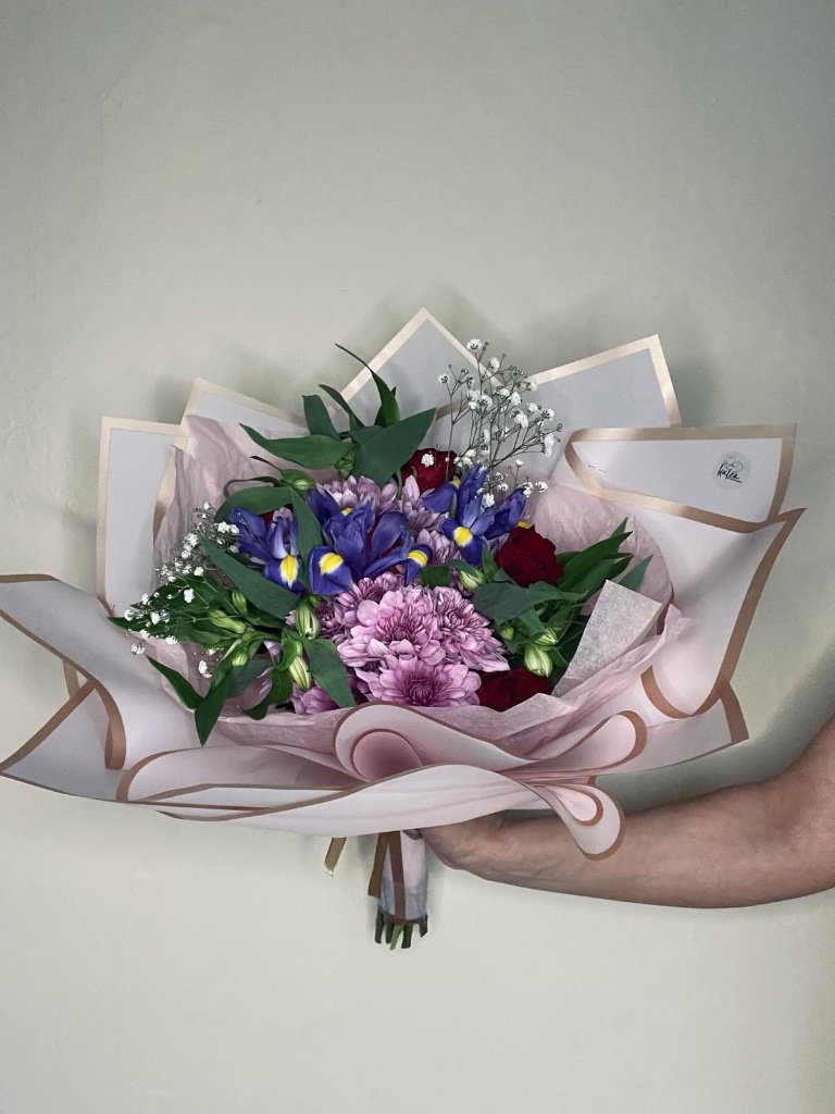 Purple iris and dahlia bouquet wrapped in blush paper by Kalea Arrangements