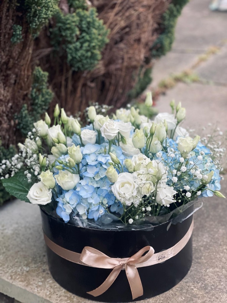 Blue hydrangea and white rose luxury box arrangement by Kalea Arrangements