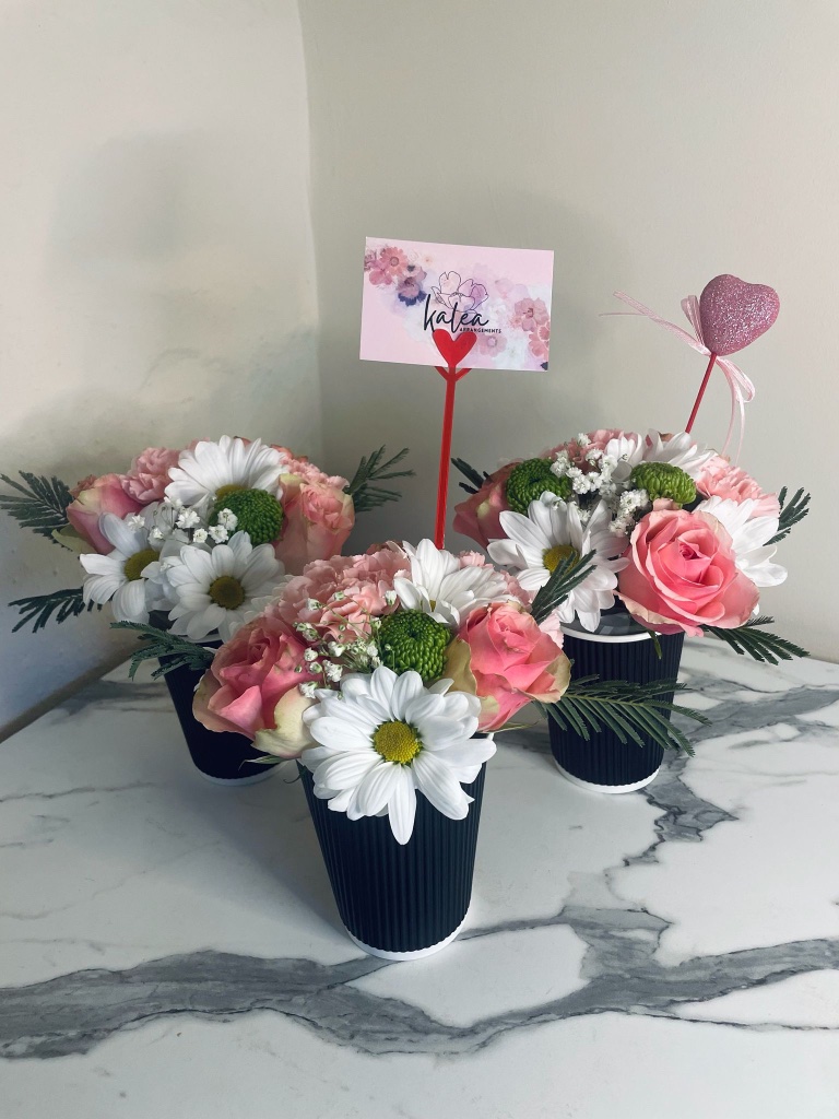 Pink and white mini flower cup arrangements by Kalea Arrangements