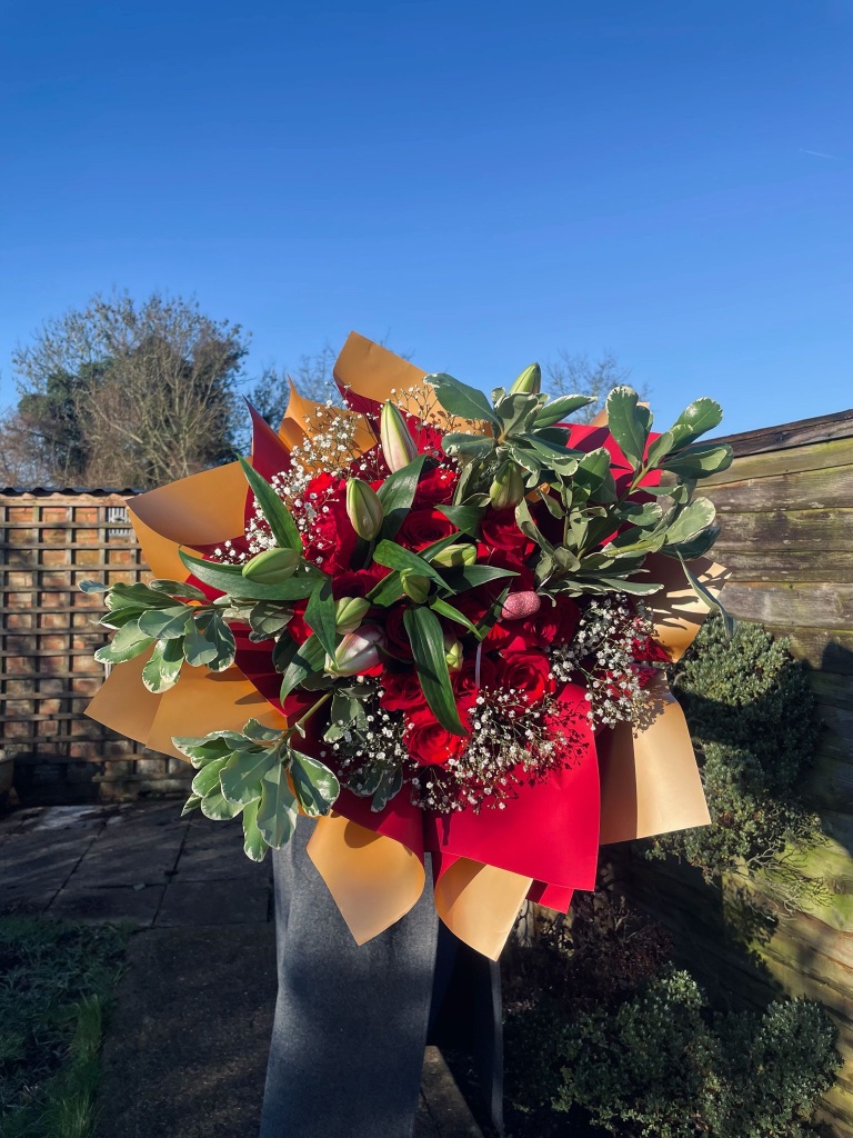 Luxury bouquet of grand red roses and lilies by Kalea Arrangements